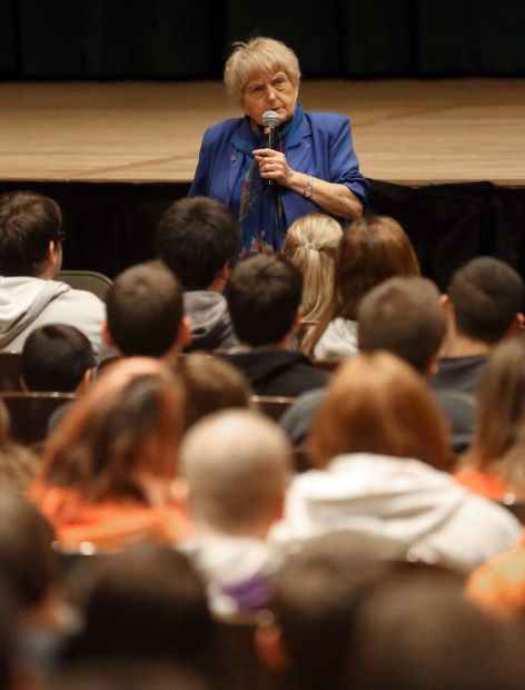 Holocaust survivor Eva Mozes Kor speaks to 8th graders at Valparaiso High School's auditorium.